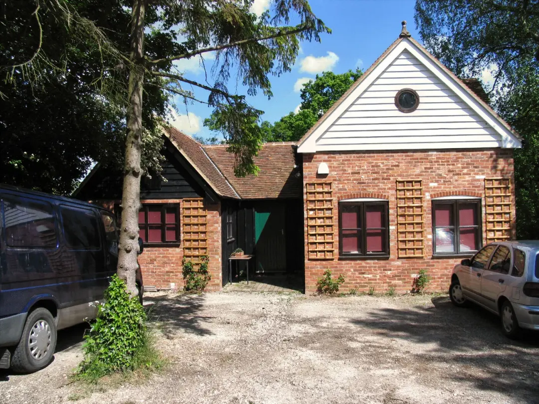 Brick and white weatherboard extension to a house