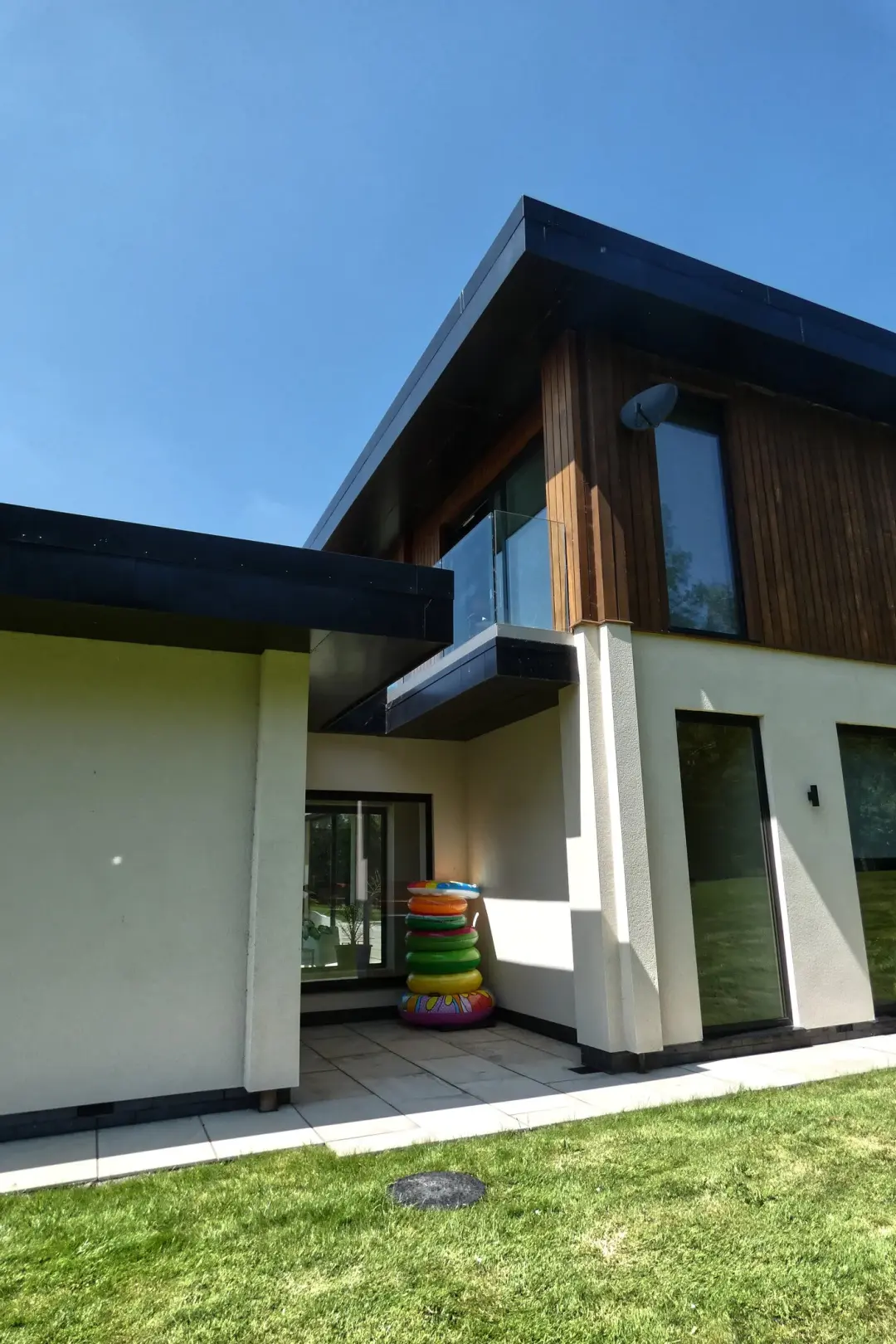 Modern house with timber cladding and a cantilevered first floor